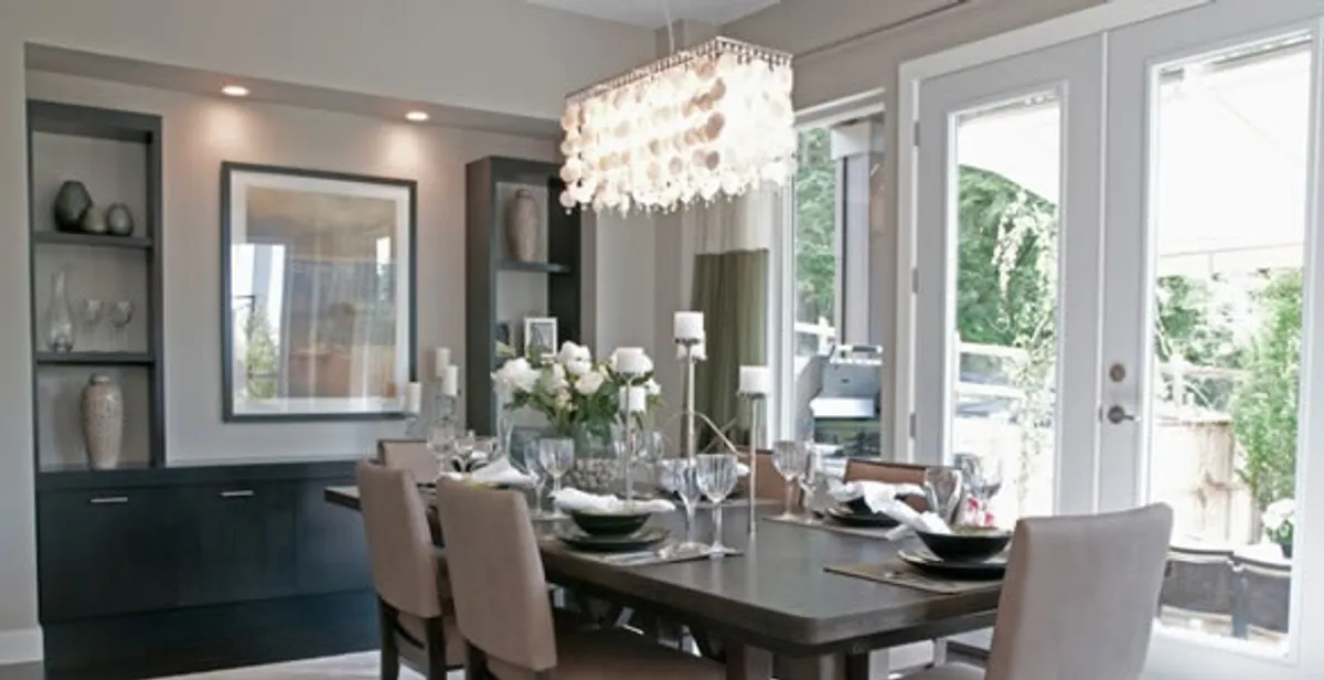 Elegant dining room chandelier installation above table in Boise, ID