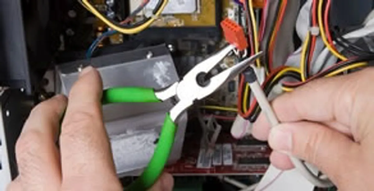 Licensed electrical contractor performing electrical repair with tools in Star, ID